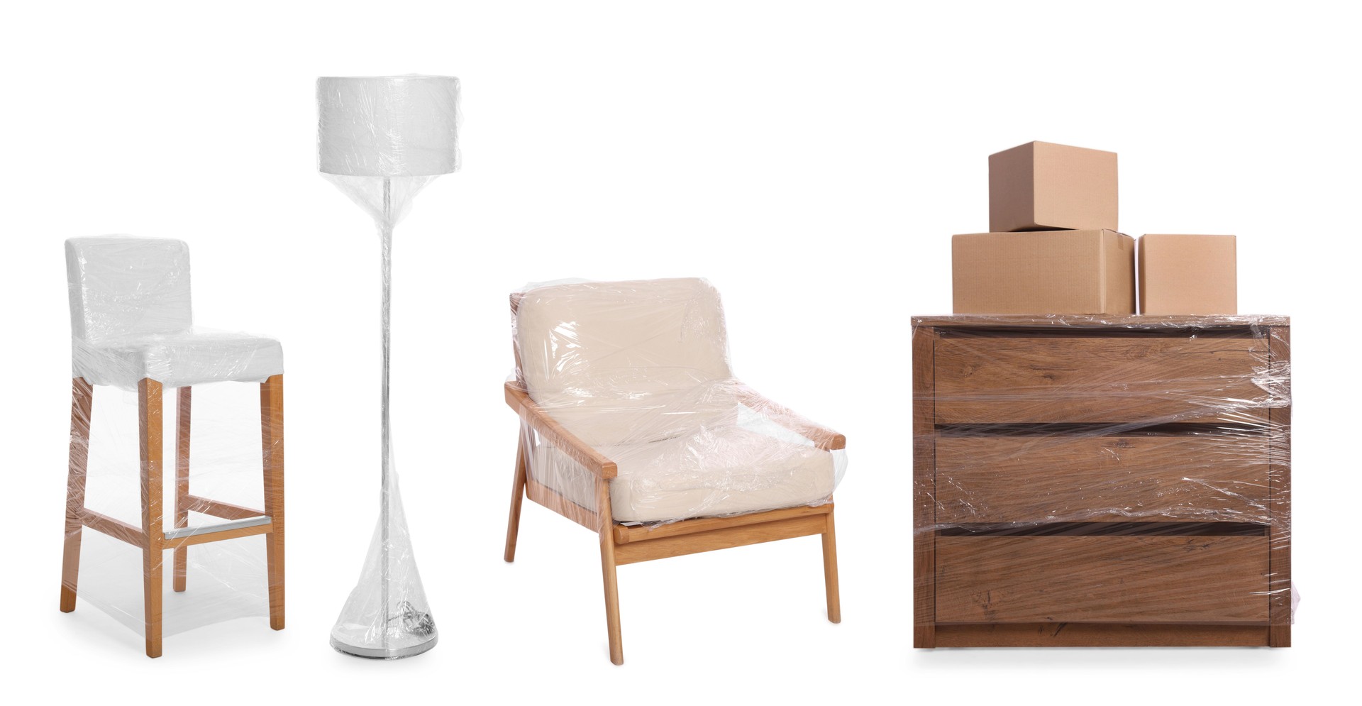 Furniture and lamp wrapped with stretch film and cardboard boxes on white background